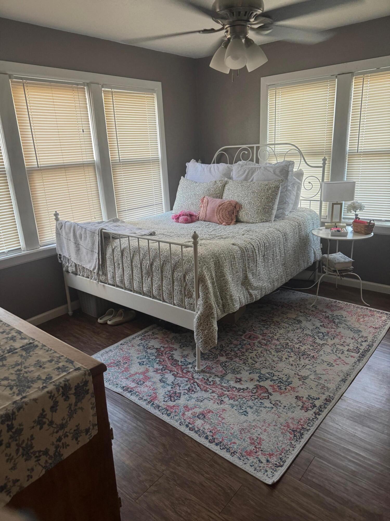 2312 15th Street Lubbock, TX 79401 - Photo 10 of 20 a bed sitting in a bedroom next to a window