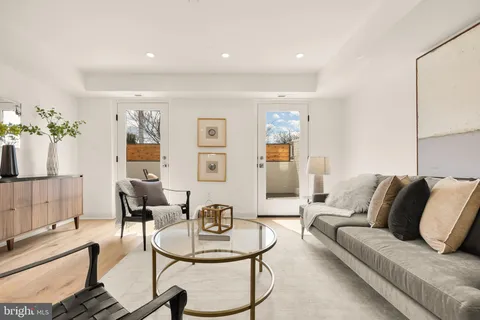 a living room with furniture and a table