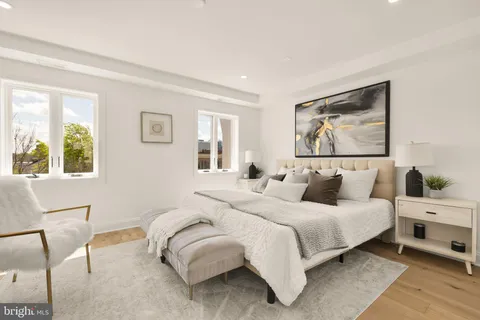 a bedroom with a large bed and a window