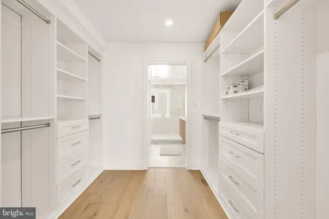 a bathroom with double vanity sinks and a bathtub