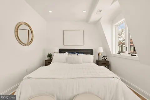 a bedroom with a bed and a vanity