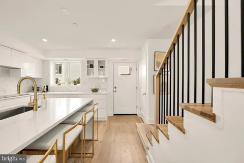a view of kitchen and wooden floor