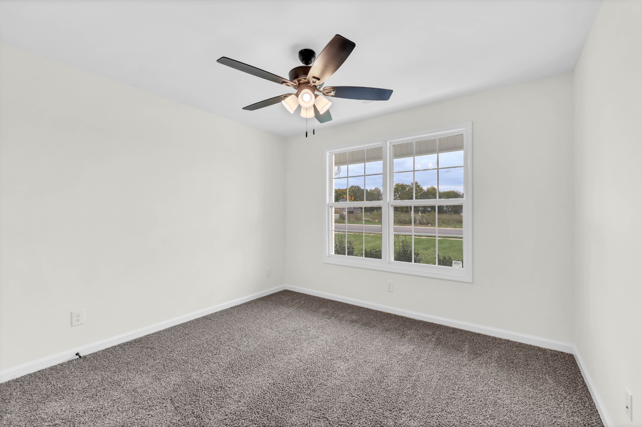 2555 Rafiki Drive Clarksville, TN 37042 - Photo 30 of 42 an empty room with windows and fan