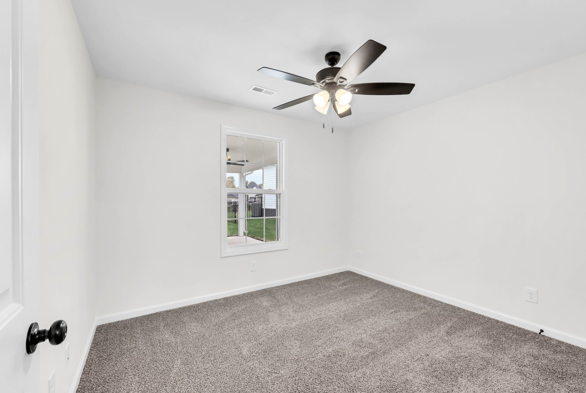 2555 Rafiki Drive Clarksville, TN 37042 - Photo 33 of 42 an empty room with a window and a fan
