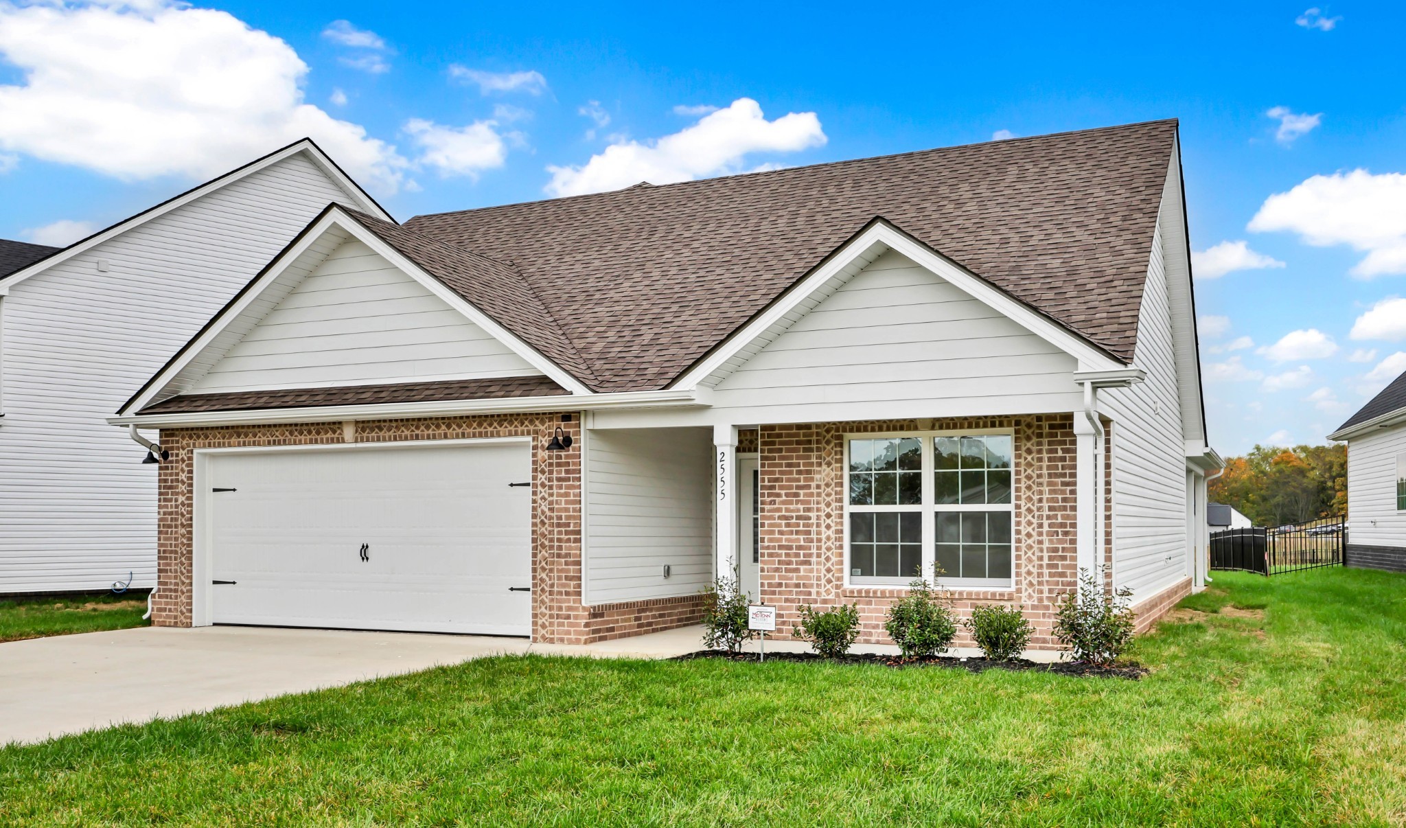 2555 Rafiki Drive Clarksville, TN 37042 - Photo 5 of 42 a front view of a house with a yard and garage