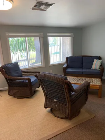 a living room with furniture and a window