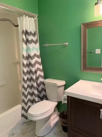 a bathroom with a sink and toilet