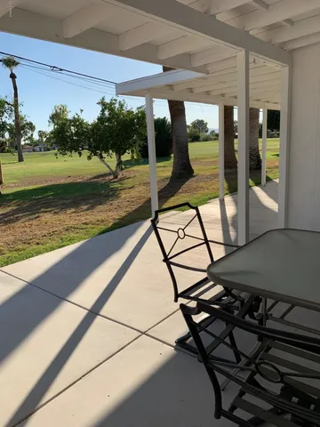 a view of a swimming pool with a patio