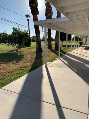 a view of swimming pool with a patio