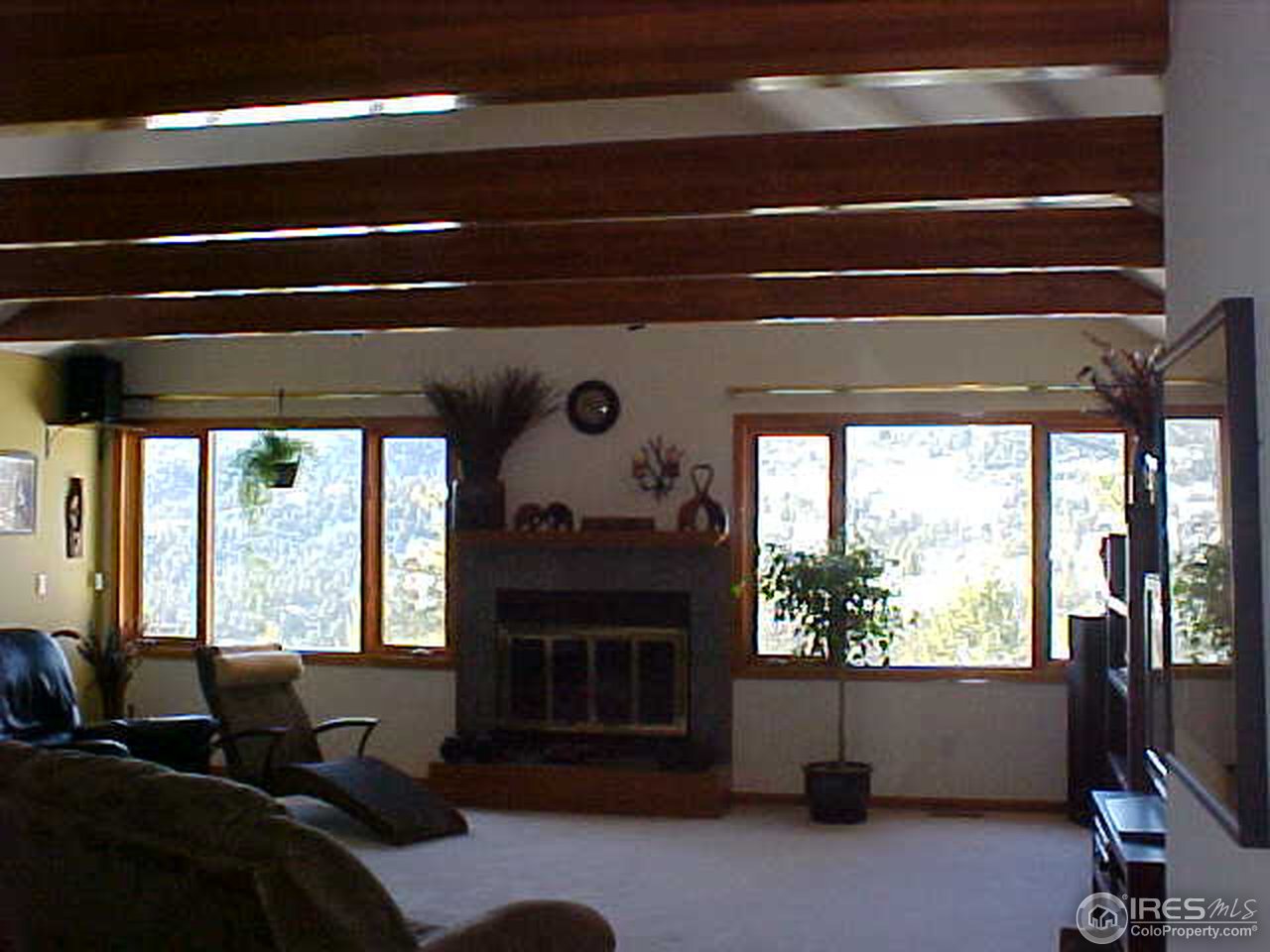 388 Peakview Road Boulder, CO 80302 - Photo 3 of 9 a living room with furniture and a window