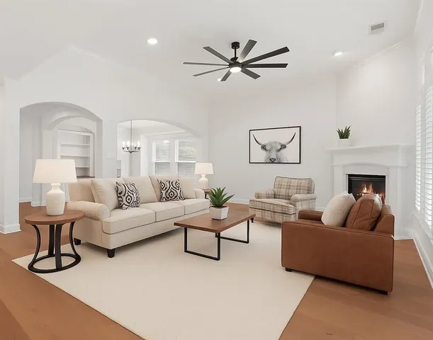 a living room with furniture and white walls