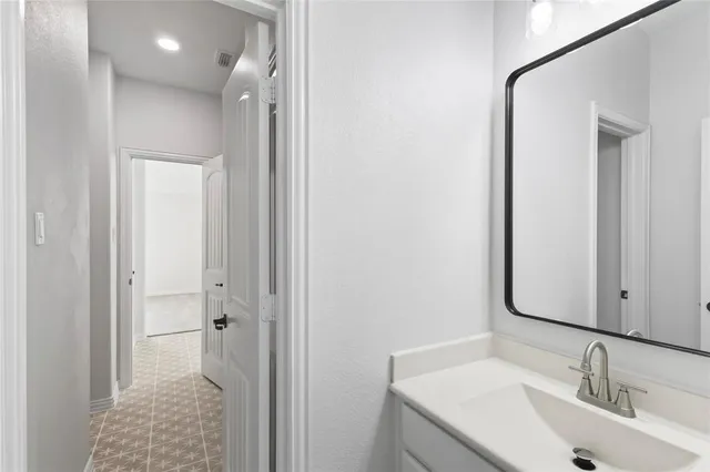 a view of a hallway with windows