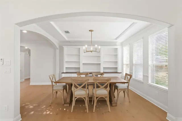 a view of a dining room with furniture and window