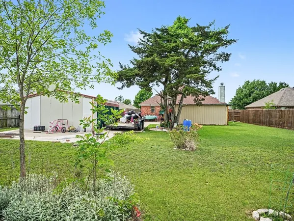 a view of backyard with a garden and entertaining space