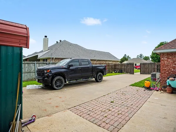 a view of a car parked in front of a house