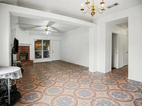a view of a livingroom with furniture window and wooden floor