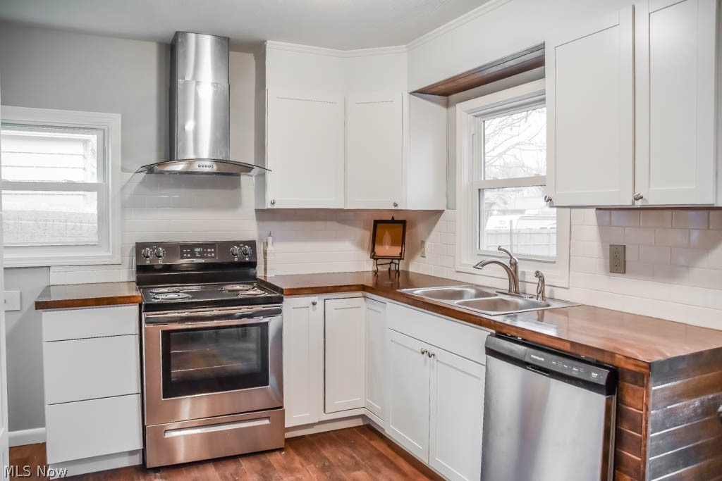 52 Canton Road Akron, OH 44312 - Photo 6 of 17 Kitchen has butcher block counters and stainless steel appliances.