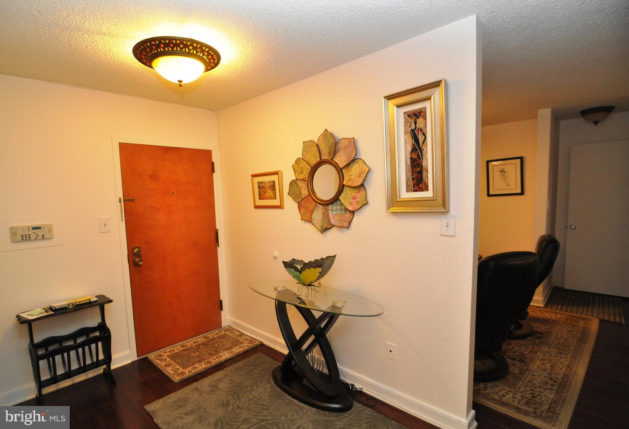 1101 South Arlington Ridge Road, Unit 204 Arlington, VA 22202 - Photo 3 of 28 a view of workspace with wooden floor windows