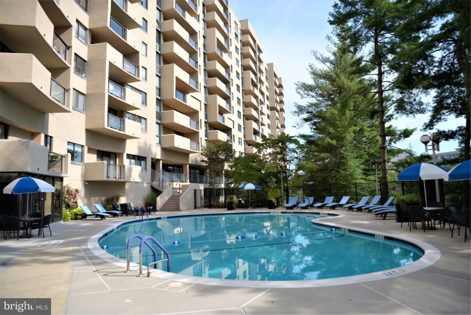 1101 South Arlington Ridge Road, Unit 204 Arlington, VA 22202 - Photo 24 of 28 a view of a swimming pool with outdoor seating