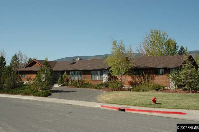 4287 Muirwood Court Reno, NV 89509 - Photo 3 of 7 a front view of a house with a yard