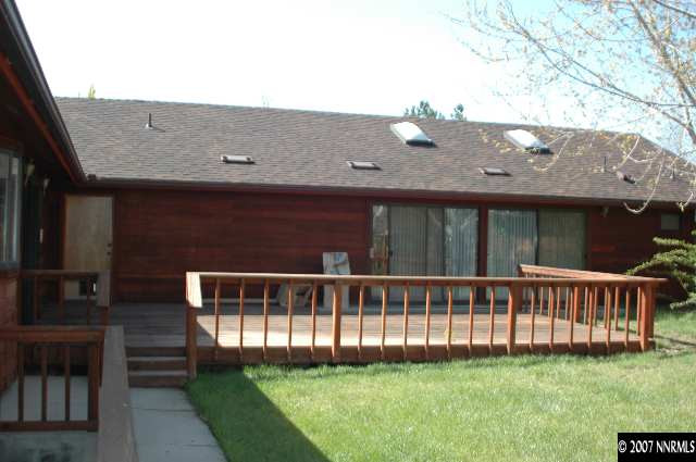 4287 Muirwood Court Reno, NV 89509 - Photo 6 of 7 a view of a house with a yard and deck