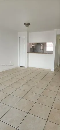 a view of wooden floor and utility room in kitchen