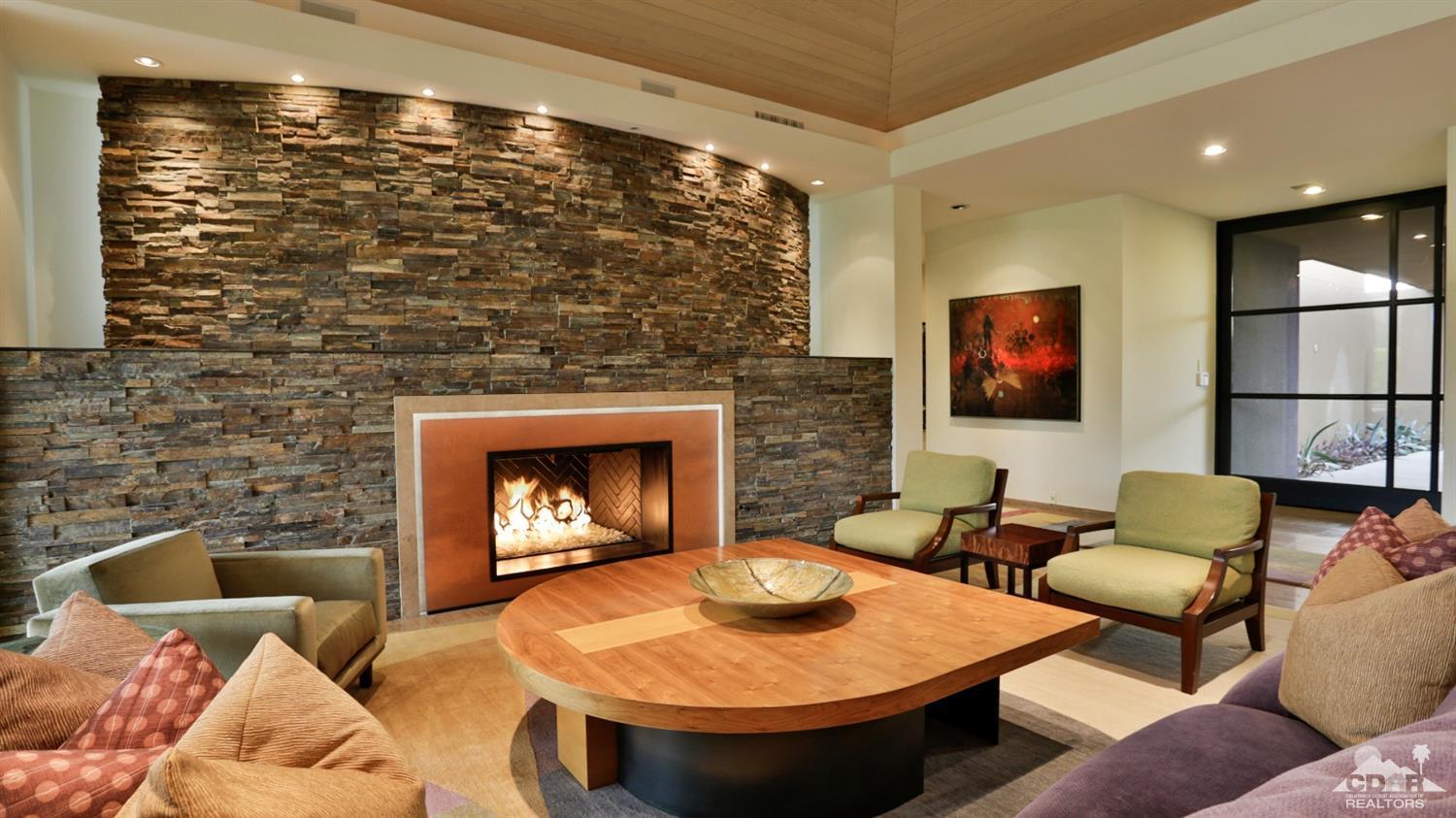 37 Sun Ridge Circle Rancho Mirage, CA 92270 - Photo 15 of 63 a living room with furniture and a fireplace