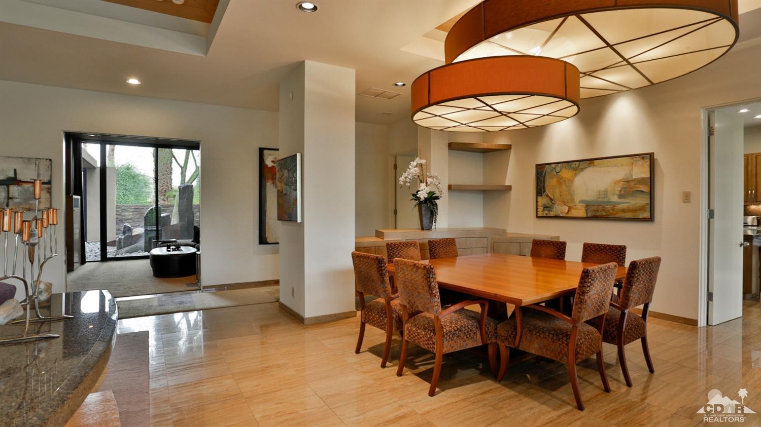 37 Sun Ridge Circle Rancho Mirage, CA 92270 - Photo 18 of 63 a view of a dining room with furniture and a chandelier