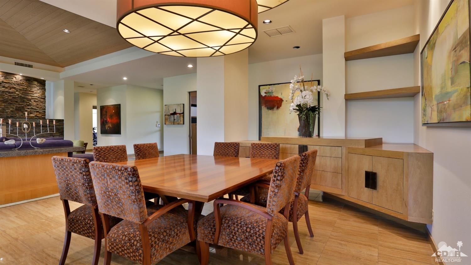 37 Sun Ridge Circle Rancho Mirage, CA 92270 - Photo 19 of 63 a view of a dining room with furniture and wooden floor