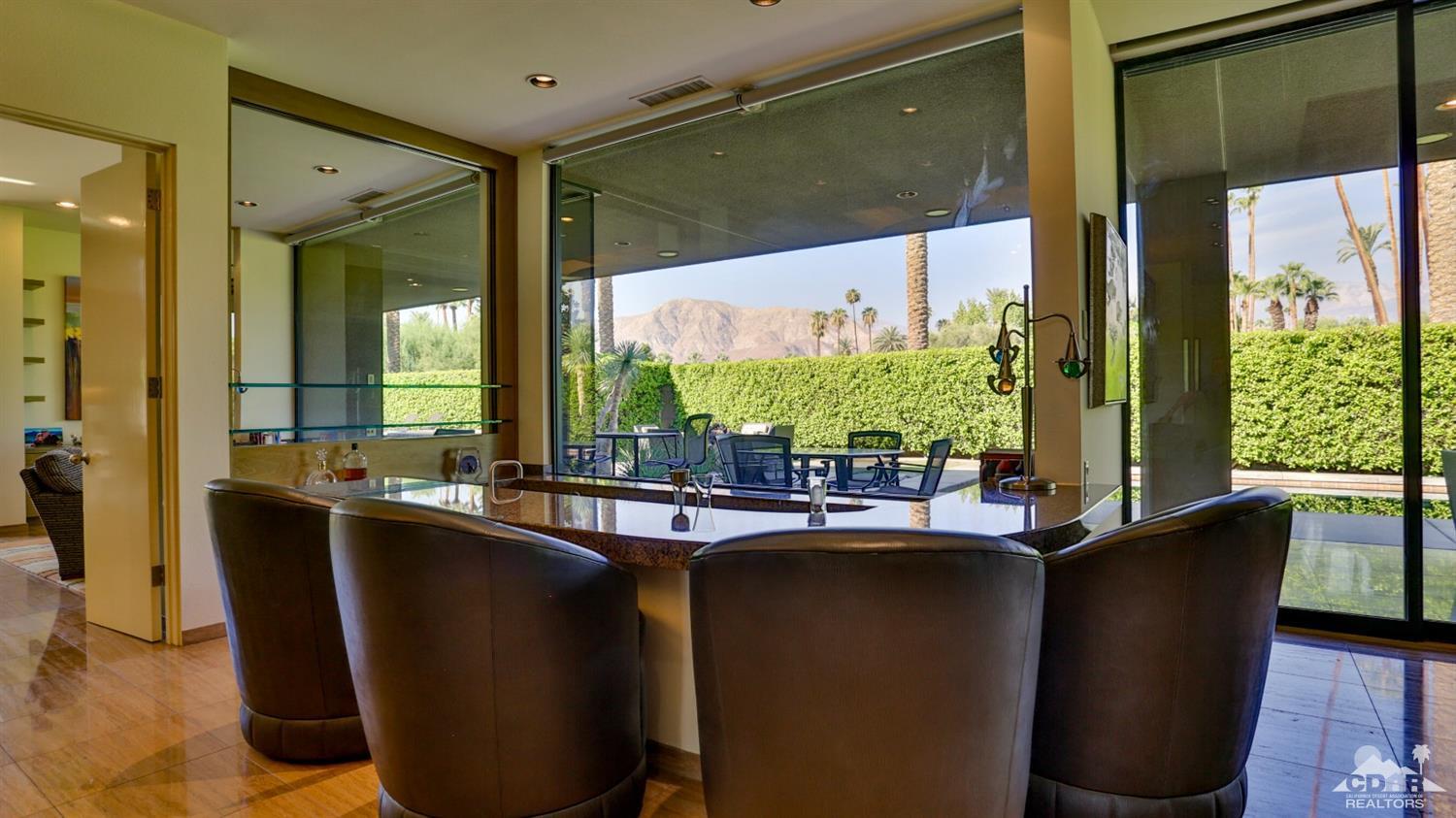 37 Sun Ridge Circle Rancho Mirage, CA 92270 - Photo 21 of 63 a dining room with stainless steel appliances granite countertop a granite counter tops and a window