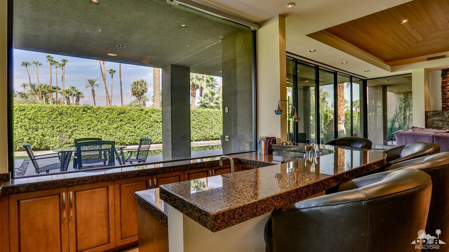 37 Sun Ridge Circle Rancho Mirage, CA 92270 - Photo 22 of 63 a kitchen with granite countertop sink and stove
