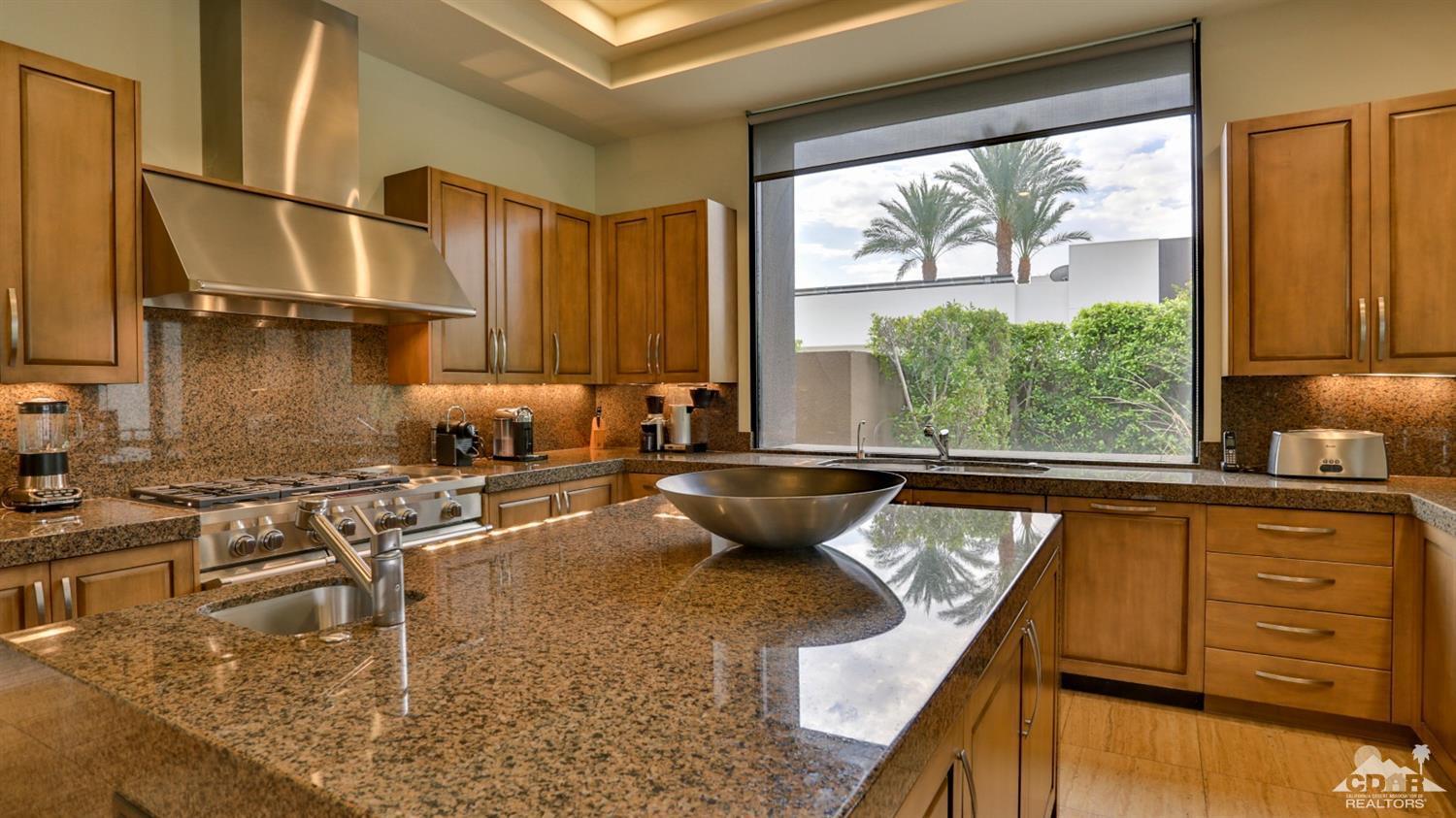 37 Sun Ridge Circle Rancho Mirage, CA 92270 - Photo 30 of 63 a kitchen with sink a window and cabinets
