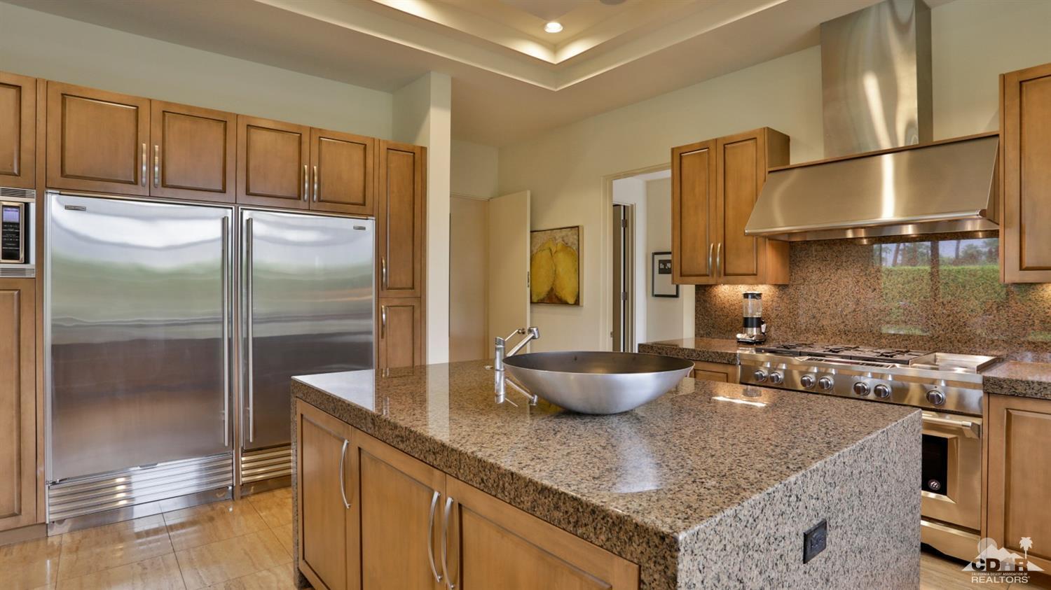 37 Sun Ridge Circle Rancho Mirage, CA 92270 - Photo 31 of 63 a kitchen with stainless steel appliances granite countertop a refrigerator a stove and a sink