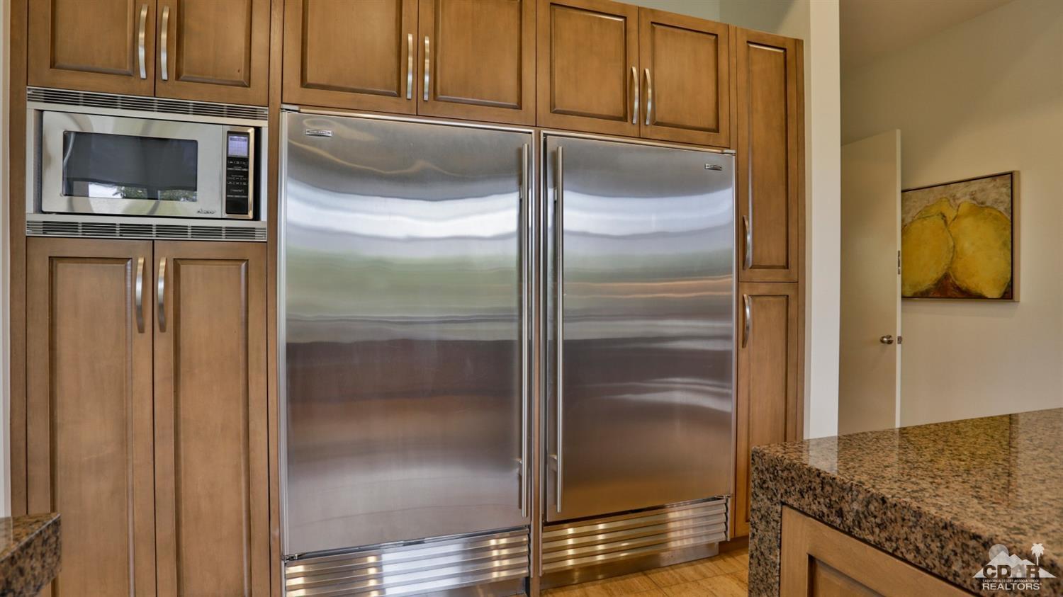 37 Sun Ridge Circle Rancho Mirage, CA 92270 - Photo 35 of 63 a kitchen with cabinets and stainless steel appliances