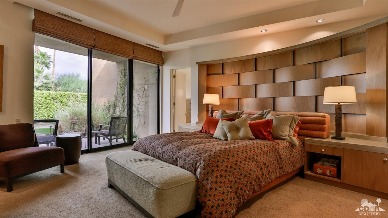 37 Sun Ridge Circle Rancho Mirage, CA 92270 - Photo 41 of 63 a bedroom with a bed couch and window