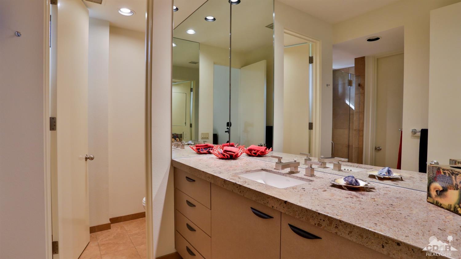 37 Sun Ridge Circle Rancho Mirage, CA 92270 - Photo 49 of 63 a bathroom with a double vanity sink mirror and double
