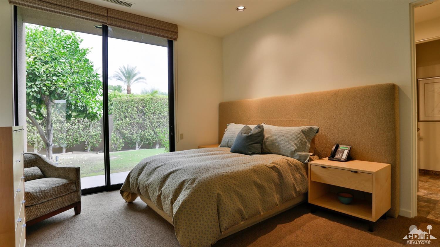 37 Sun Ridge Circle Rancho Mirage, CA 92270 - Photo 50 of 63 a bedroom with a bed and a couch