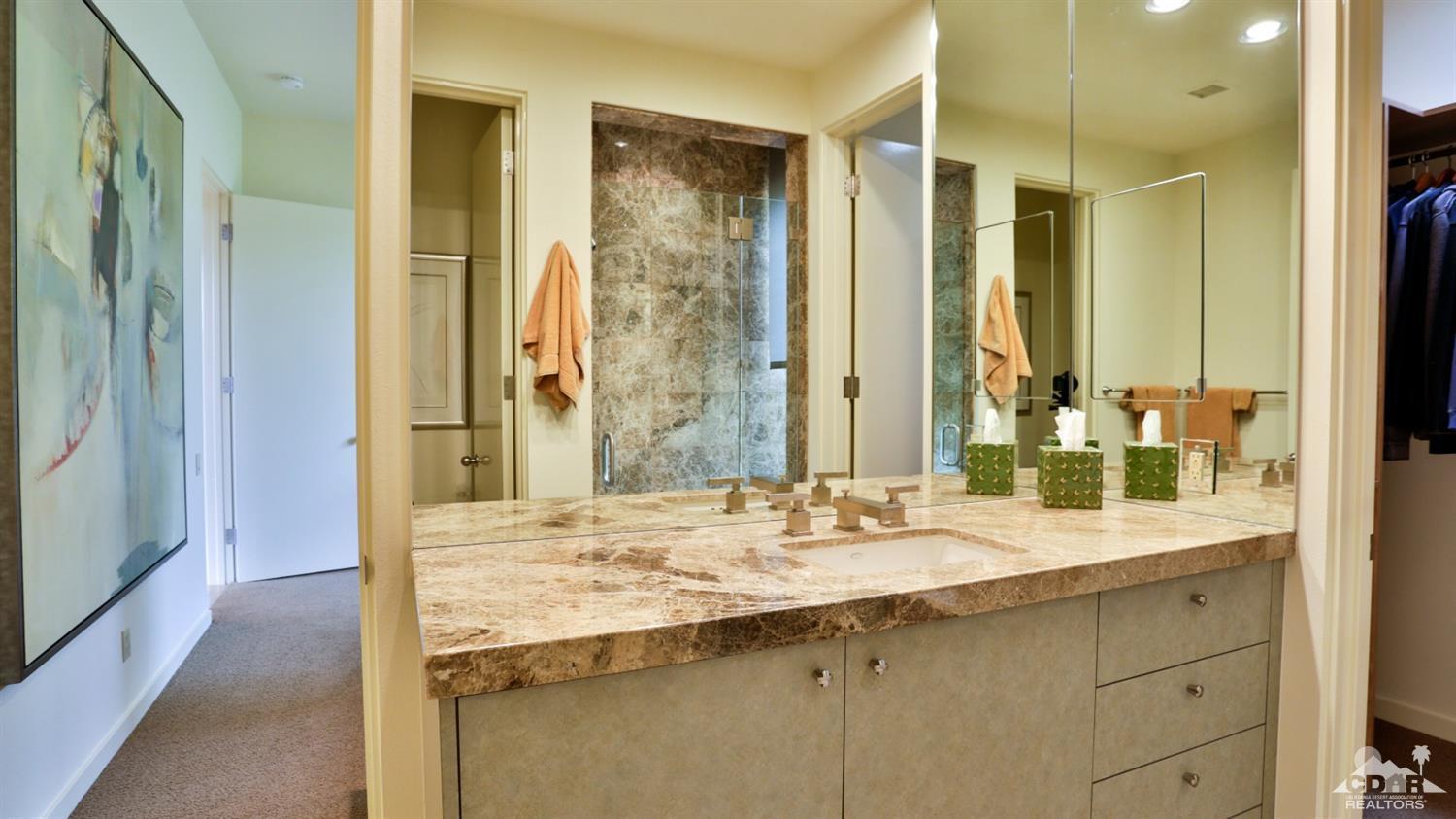 37 Sun Ridge Circle Rancho Mirage, CA 92270 - Photo 53 of 63 a bathroom with a sink double vanity and a shower