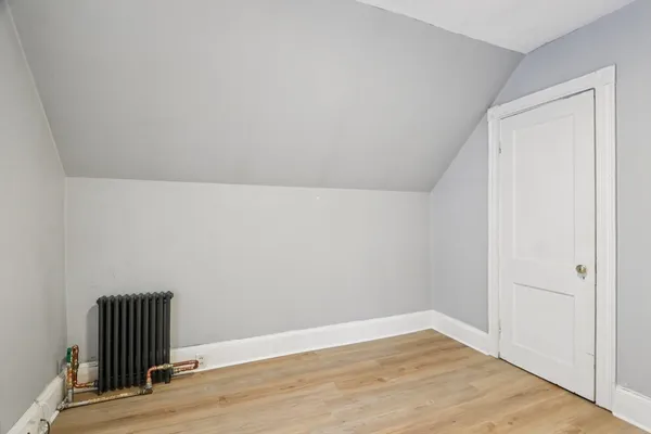 an empty room with wooden floor