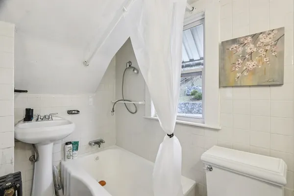 a bathroom with a sink a toilet and a bathtub