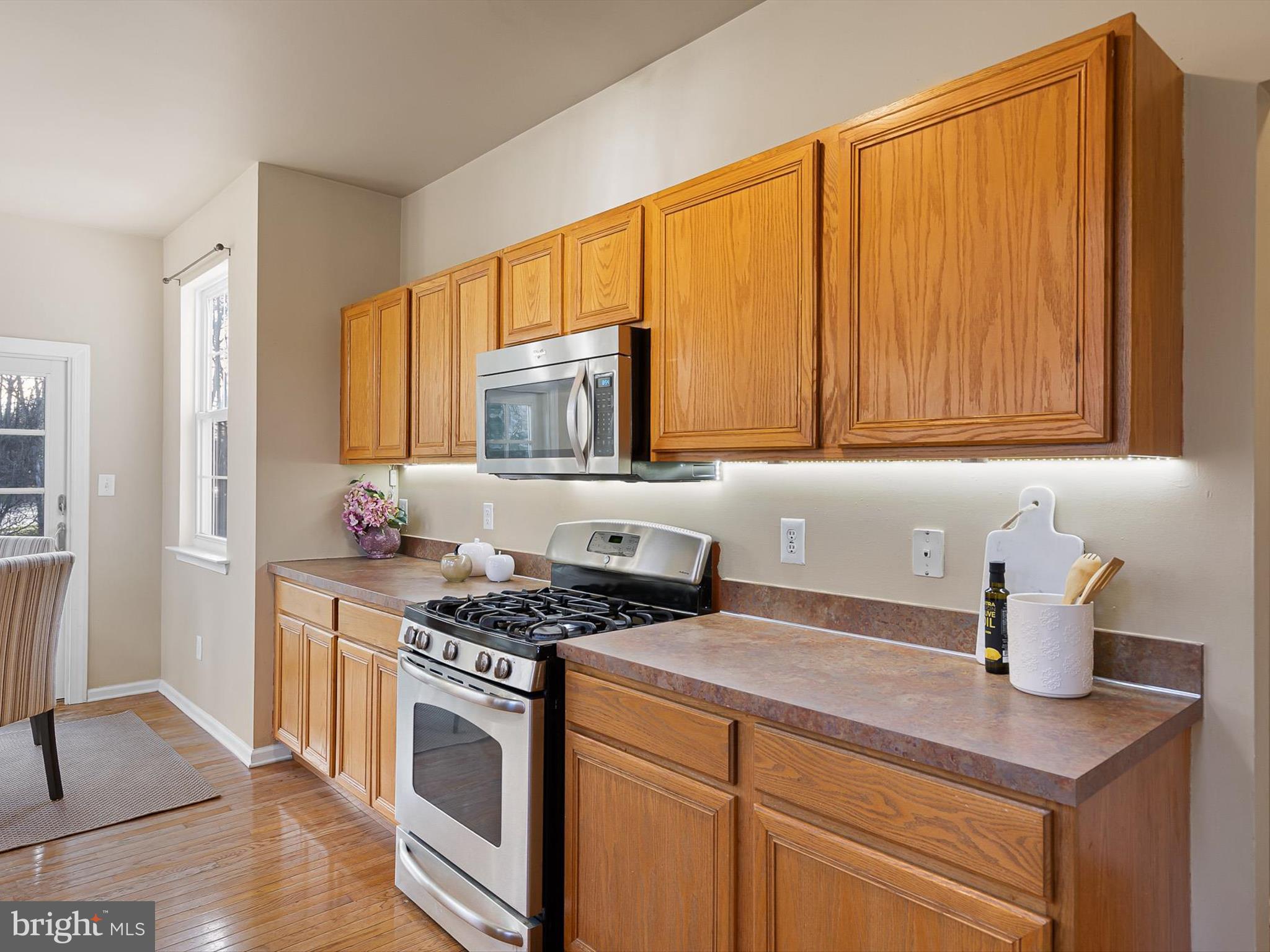 5 Meghan Lane Bear, DE 19701 - Photo 12 of 41 a kitchen with stainless steel appliances a stove a sink and cabinets
