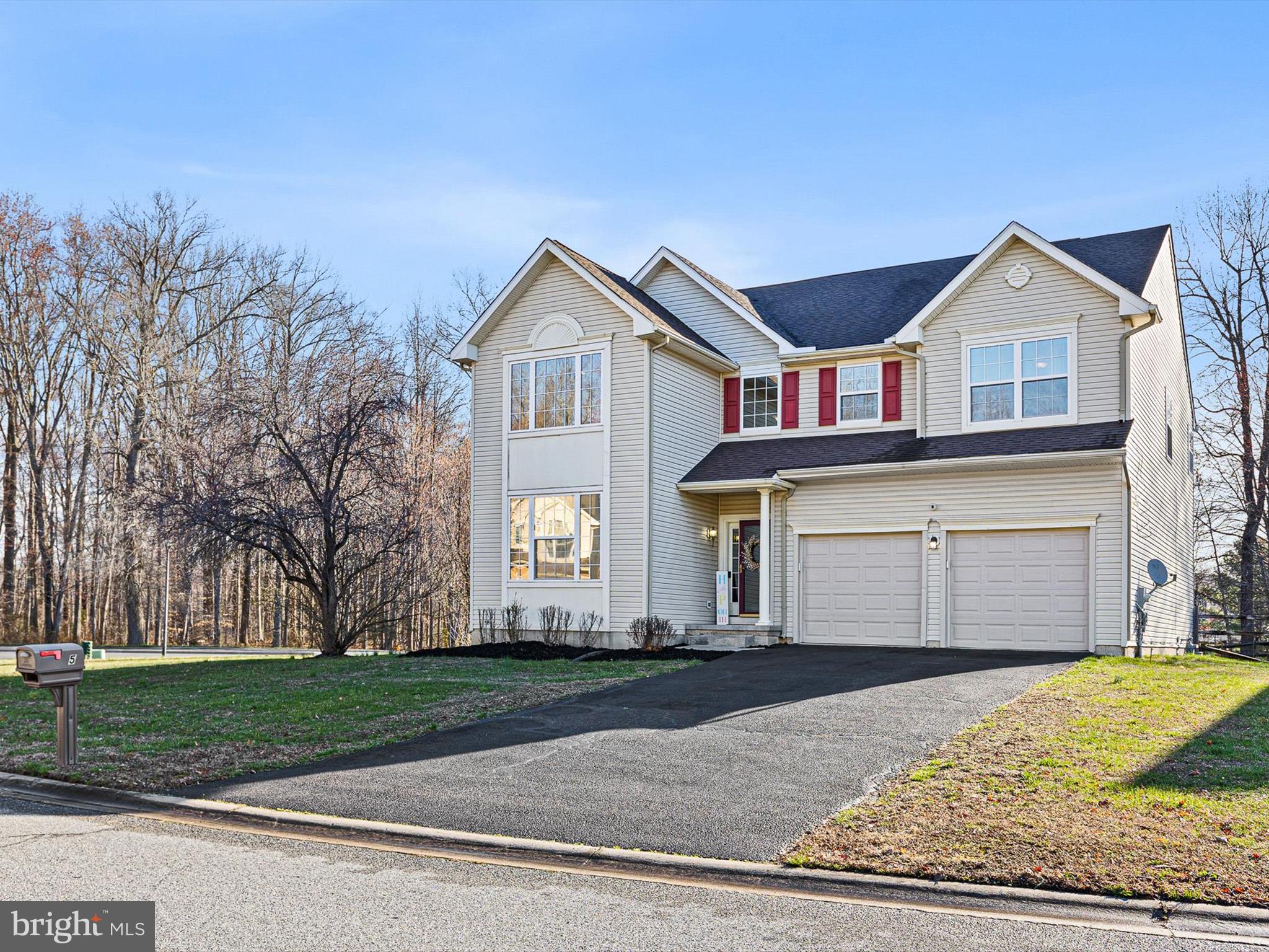 5 Meghan Lane Bear, DE 19701 - Photo 2 of 41 a front view of a house with a yard and garage