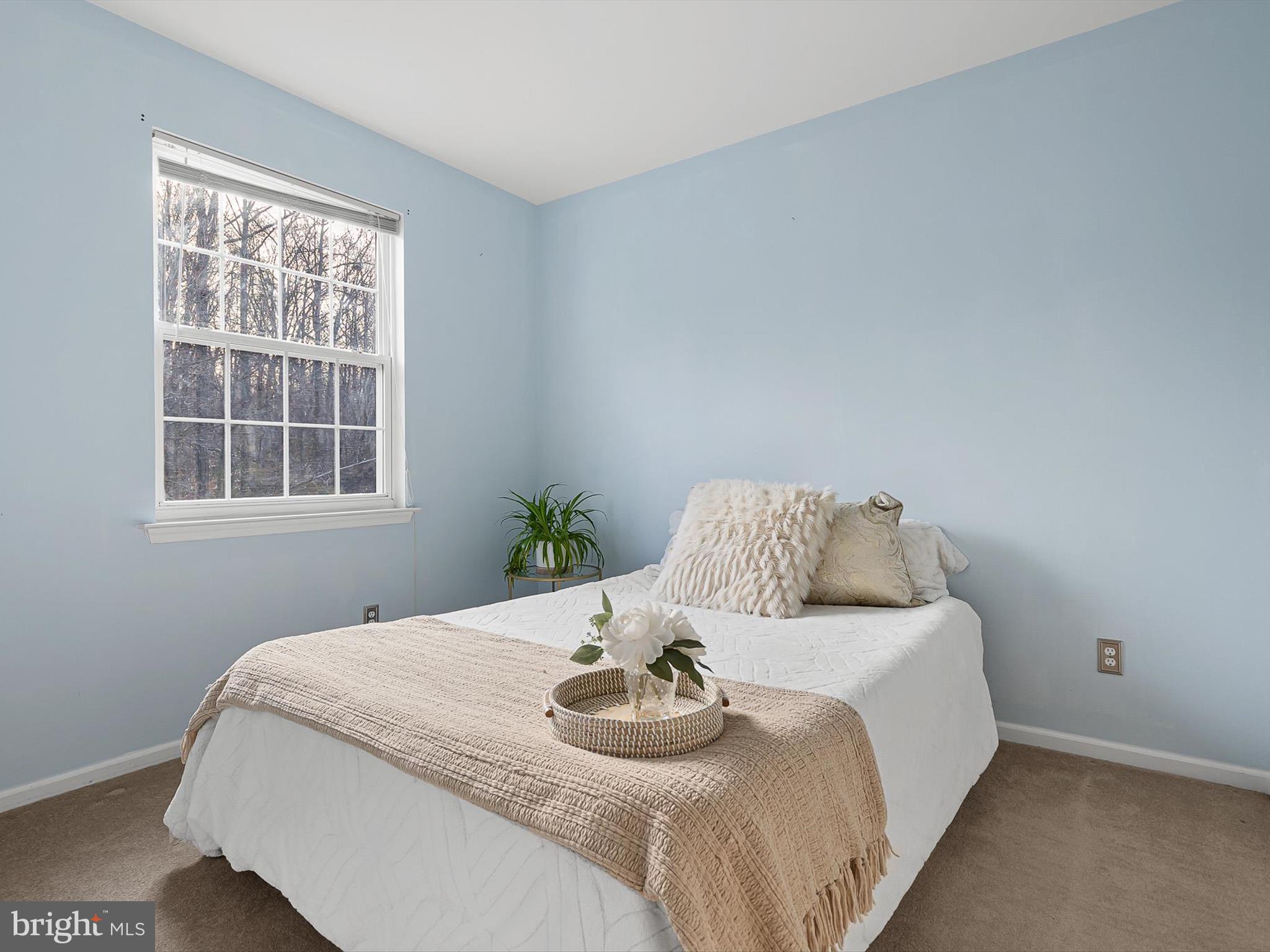 5 Meghan Lane Bear, DE 19701 - Photo 26 of 41 a bedroom with a bed and wooden floor