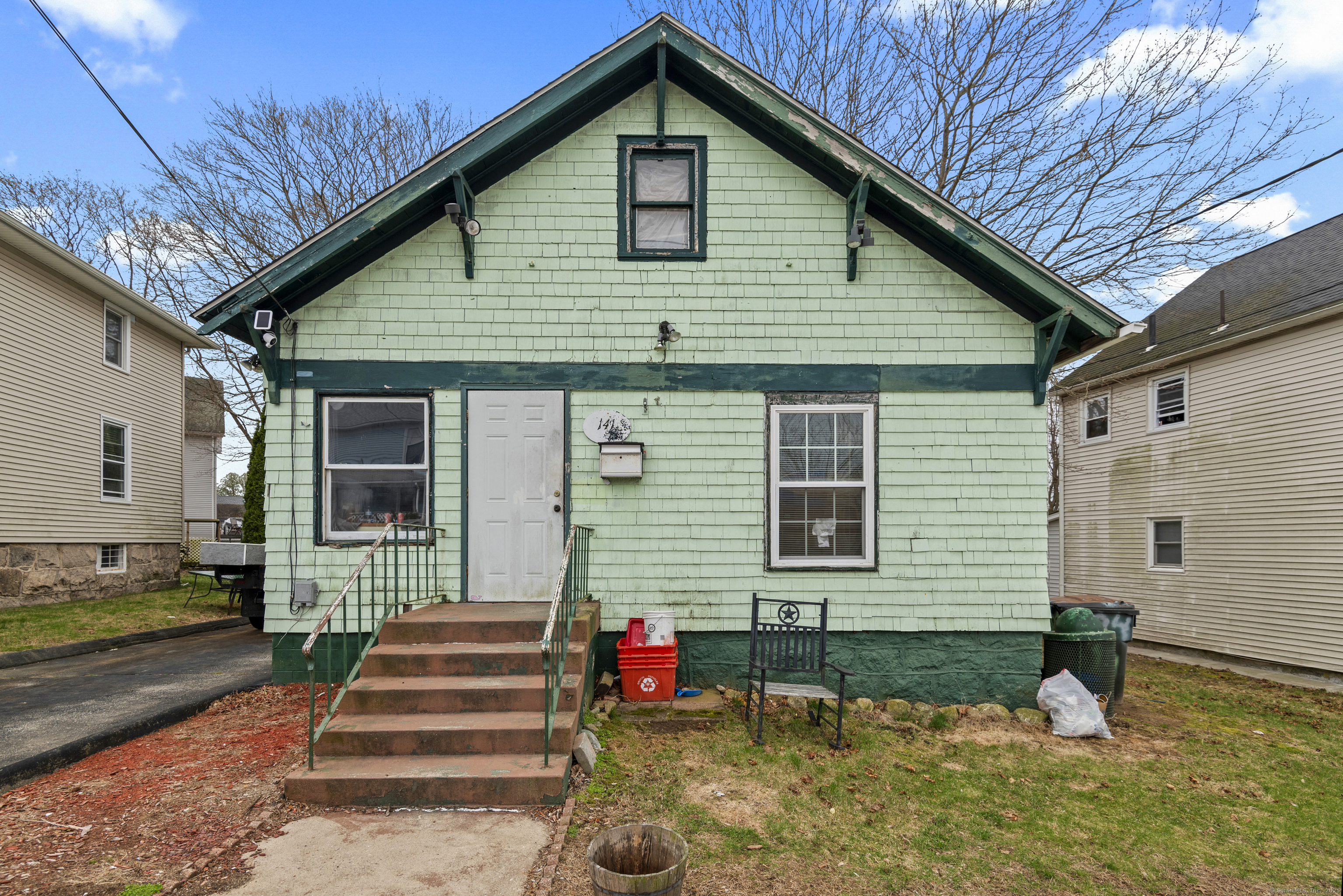 141 Poquonnock Road Groton, CT 06340 - Photo 1 of 1 a front view of a house with a yard