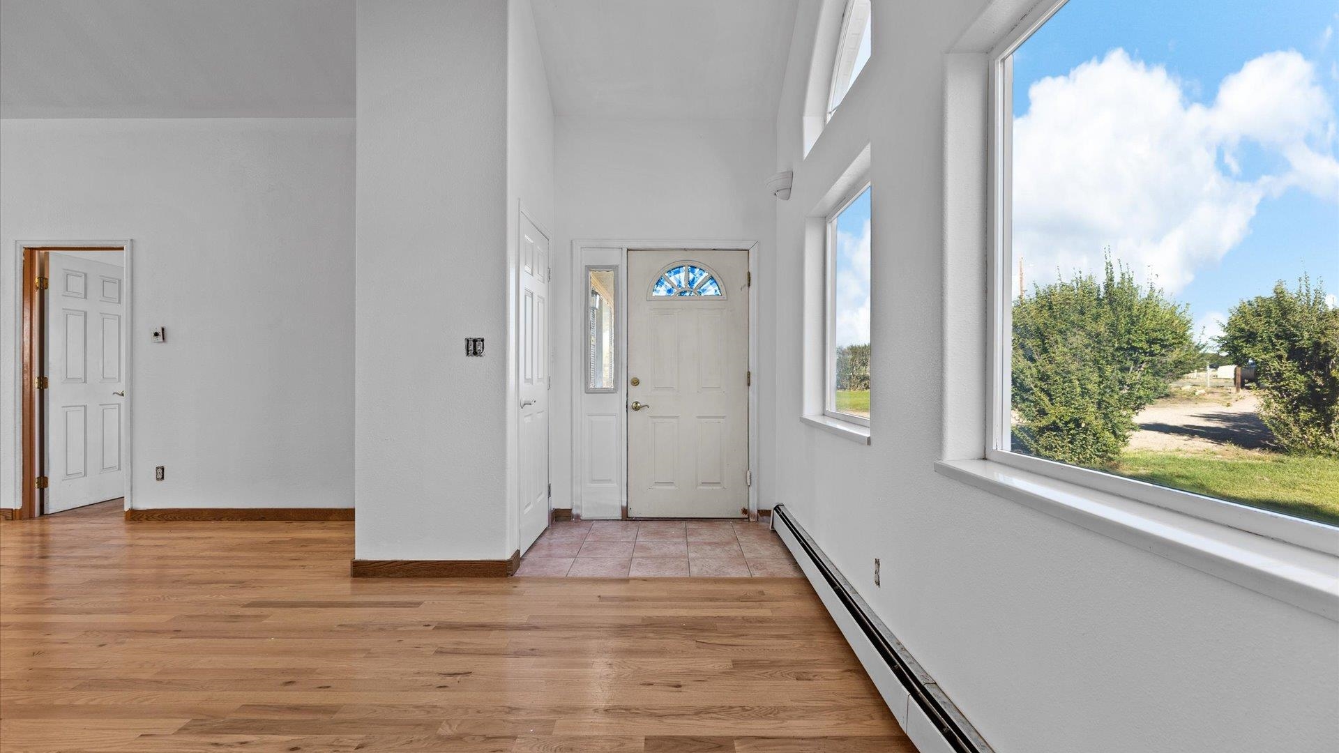 1351 M M 1/4 Road Loma, CO 81524 - Photo 17 of 36 a view of a hallway with wooden floor and a window
