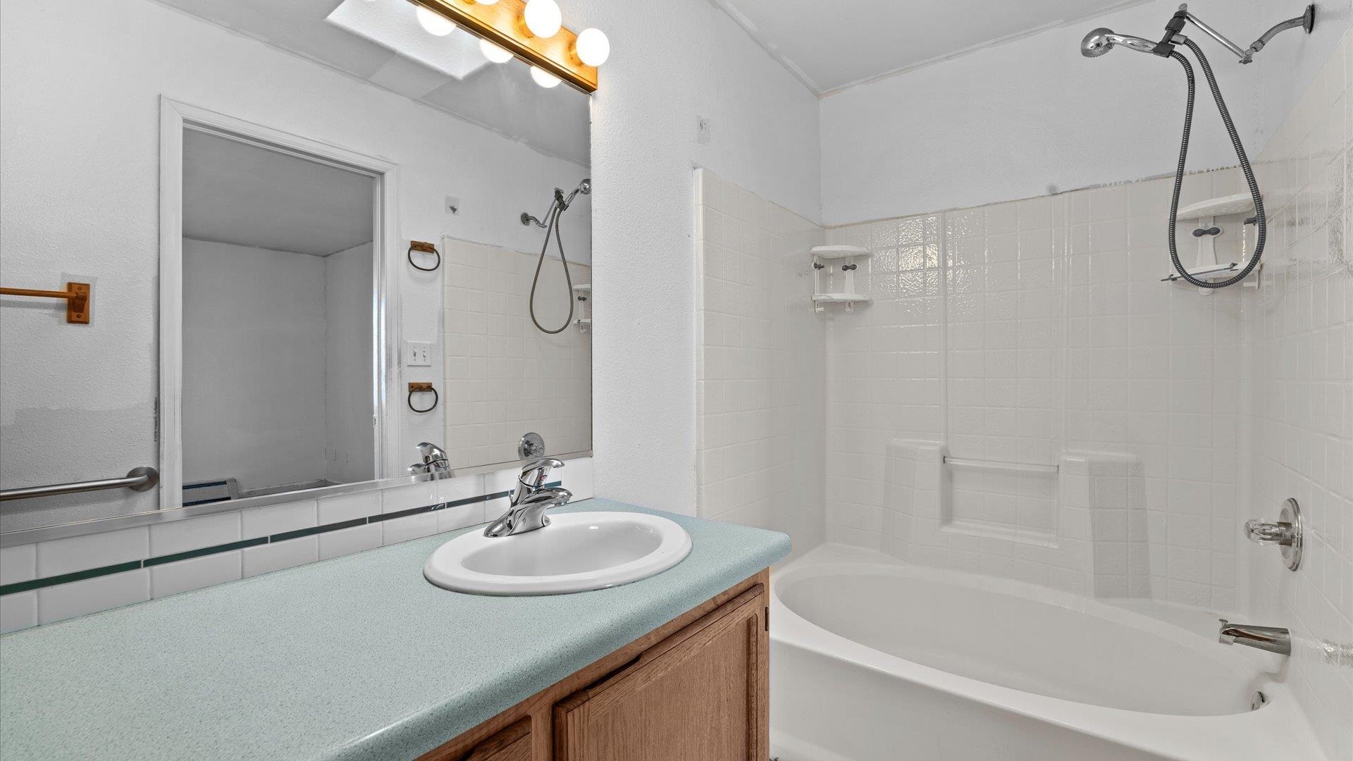 1351 M M 1/4 Road Loma, CO 81524 - Photo 21 of 36 a bathroom with a sink and a mirror