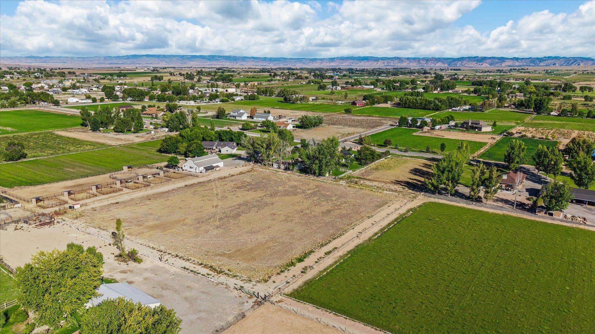 1351 M M 1/4 Road Loma, CO 81524 - Photo 31 of 36 an aerial view of residential houses with outdoor space and trees