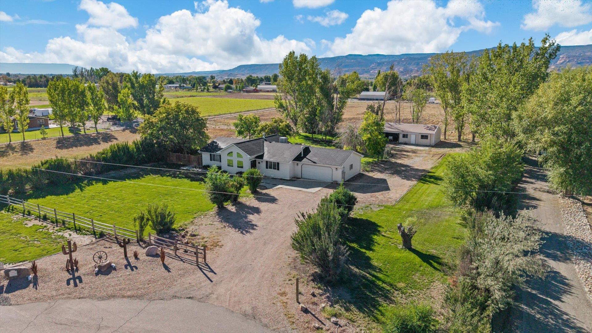 1351 M M 1/4 Road Loma, CO 81524 - Photo 32 of 36 an aerial view of a houses with a swimming pool