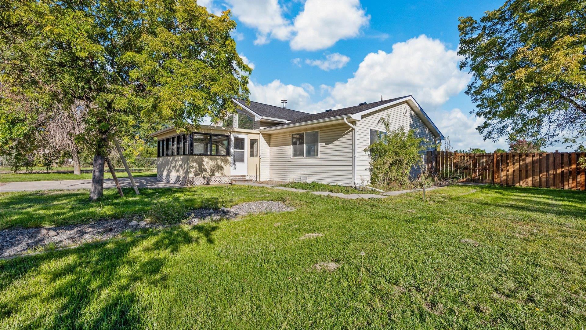 1351 M M 1/4 Road Loma, CO 81524 - Photo 8 of 36 a front view of a house with garden