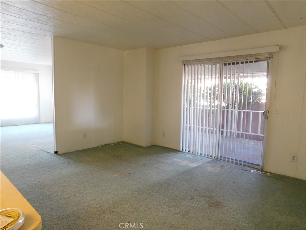 10675 Bryant Street, Unit 112 Yucaipa, CA 92399 - Photo 11 of 49 an empty room with windows